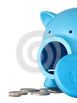 Piggy bank with coins on white isolated background with clipping path