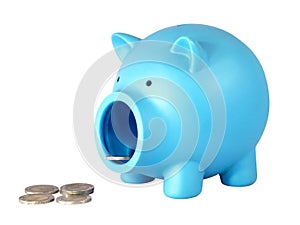 Piggy bank with coins on white isolated background with clipping path