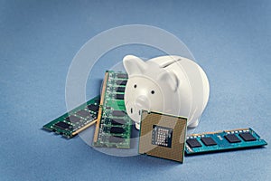 Piggy bank and computer chips, RAM, processor