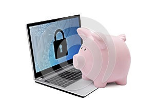 Piggy bank with computer security system on laptop. Banking protection.