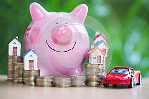 Piggy bank, concept of saving money for house and car, Business