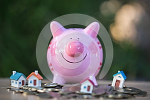 Piggy bank, concept of saving money for house, Savings money for buy house and loan to business investment for real estate concept