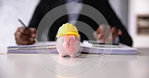 Piggy Bank With Construction Hard Hat