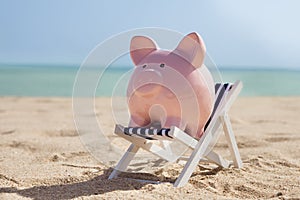 Piggy bank with deckchair photo
