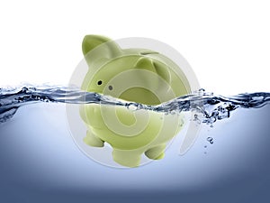 Piggy bank drown in water photo