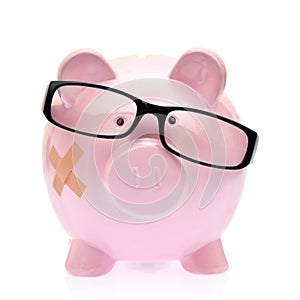 Piggy bank with eyeglasses