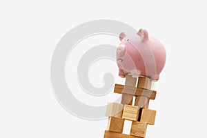 Piggy Bank on Falling Wood Block Tower