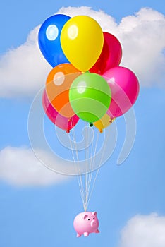 Piggy Bank floating through the sky on balloons