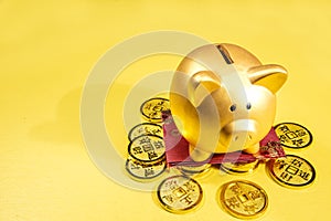 Piggy bank with golden coins and red envelopes