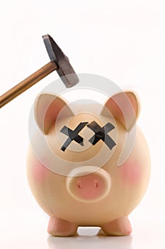 Piggy Bank with hammer over piggy's head