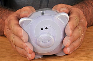 Piggy bank in hand in close up