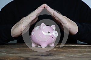 Piggy bank, hand made as an umbrella, financial insurance