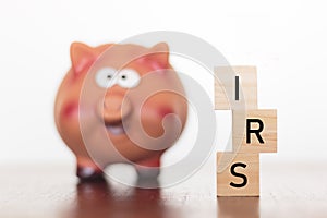 Piggy bank and IRS word photo