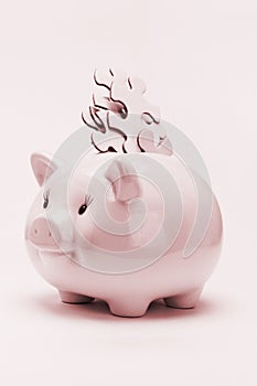 Piggy bank and jigsaw puzzles financial disarray