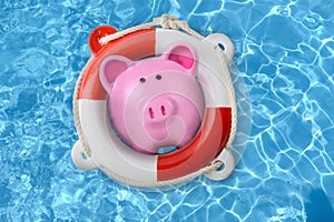 Piggy bank in a lifebuoy