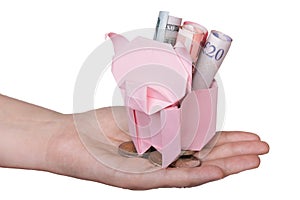 Piggy bank looking up for the coin isolated on white