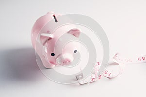 Piggy bank and measuring tape