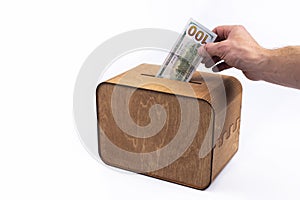 Piggy bank Money box. Euro dollar. Wooden box. On a white background.