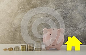 Piggy bank of money with coins stack stair step up growing growth saving money for house. Concept business financial