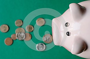 Piggy Bank with Money, Cute piggy bank on color background photo