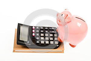 Piggy bank money savings. Piggy bank pink pig and calculator. Exchange rates. Economics and business administration