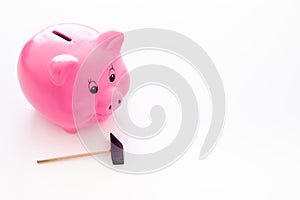 Piggy bank. Moneybox in shape of pig near hammer on white background copy space