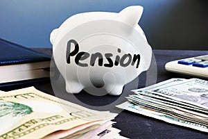 Piggy bank with pension and money. Retirement planning.