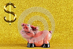 Piggy bank-pig on a gold background with a dollar sign. Keeping money and investment concept