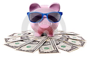 Piggy Bank, pile of dollars, summer vacation travel saving concept