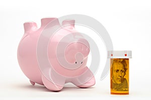 Piggy Bank and Pill Bottle Isolated on White