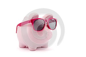 Piggy bank with pink glasses