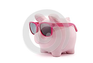 Piggy bank with pink glasses