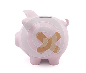Piggy bank with plaster