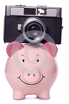 Piggy bank with retro camera cutout