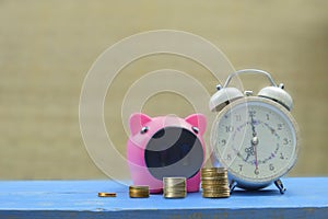 Piggy bank save coin and alarm clock