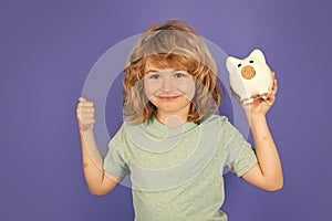 Piggy bank for saving money concept. Child boy hold piggy bank. Kid with piggybank.