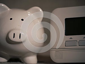 Piggy bank savings and central heating thermostat controls