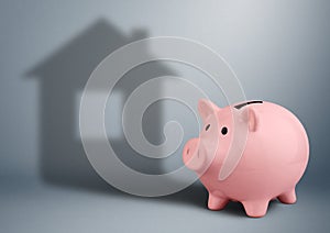 Piggy bank with shadow as house,housing industry finance concept