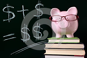 Piggy Bank with simple savings growth plan formula written on blackboard