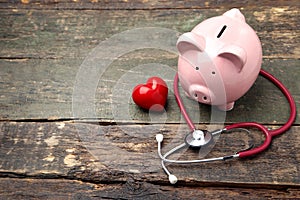 Piggy bank with stethoscope