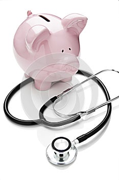 Piggy bank and stethoscope