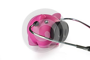 Piggy bank with stethoscope