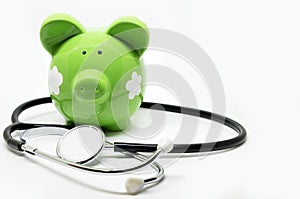 Piggy bank and stethoscope