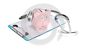 Piggy bank, stethoscope and clipboard on white background