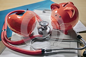 Piggy bank, stethoscope and heart concept for health and medical insurance