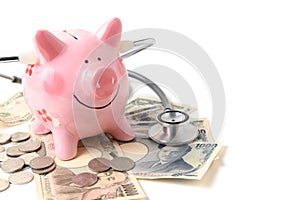 Piggy bank with Stethoscope  isolated