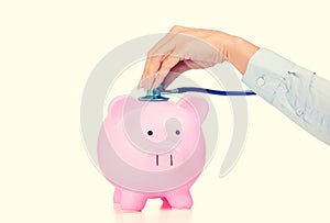 Piggy bank and Stethoscope Isolated on white background