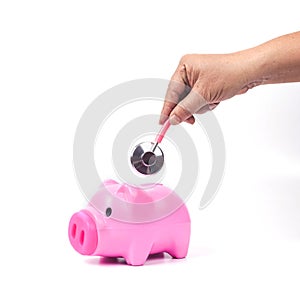 Piggy bank with stethoscope in save health