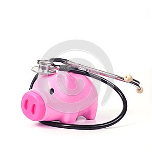 piggy bank with stethoscope in save health