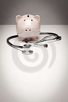 Piggy Bank and Stethoscope with Selective Focus